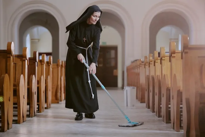 senior-nun-wiping-floor-church